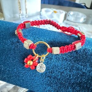 Vibrant Red and Gold Macramé Bracelet with Charms